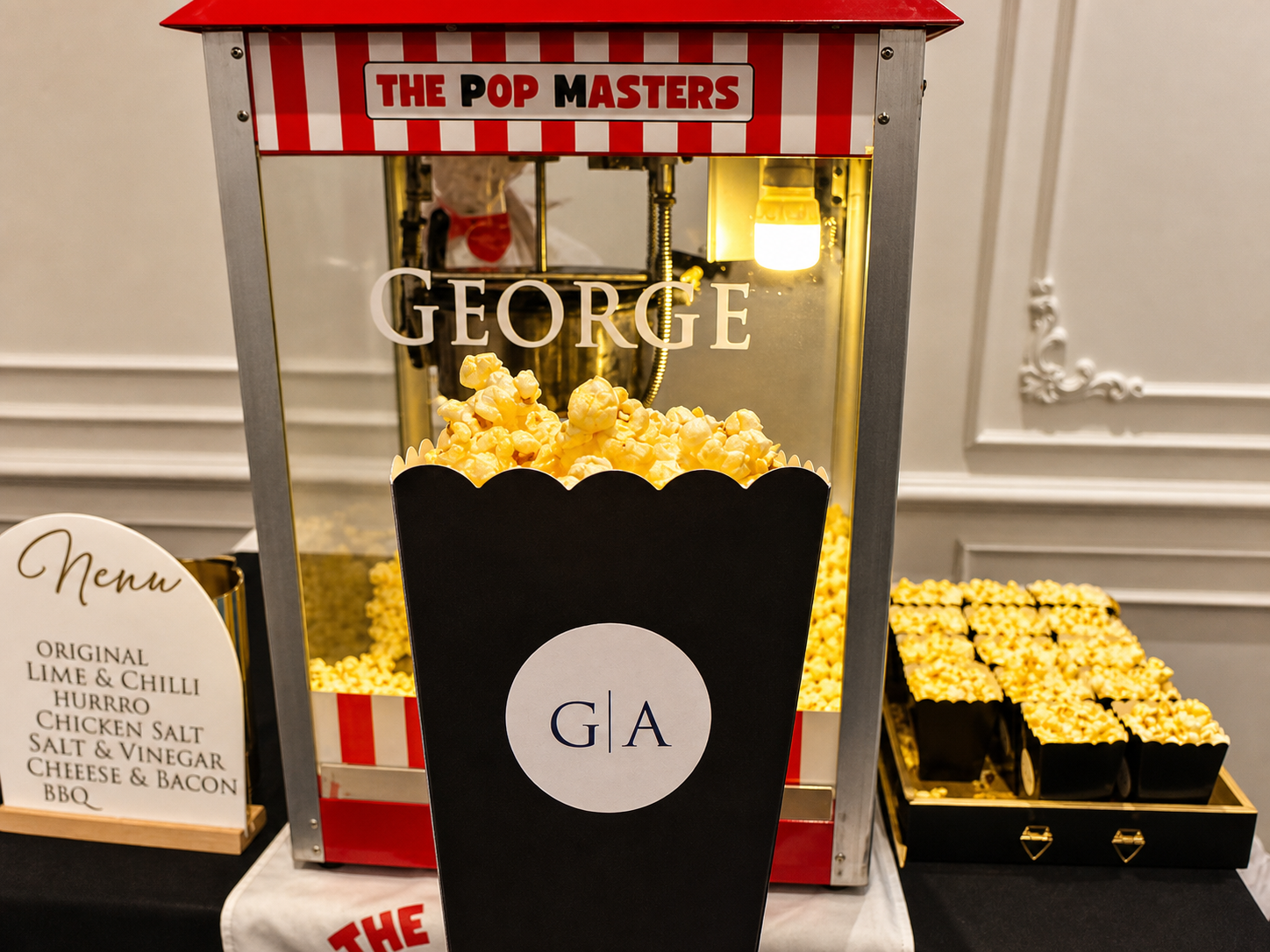 A personalised G and A popcorn bag at a customised Pop Masters setup